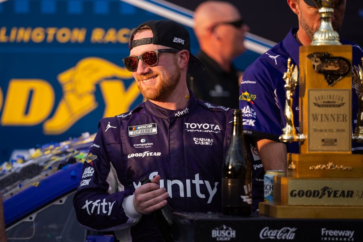 Mar 22, 2026; Darlington, South Carolina, USA; 23XI Racing Tyler Reddick (45) celebrates in Victory Lane after winning at Darlington Raceway. Mandatory Credit: Scott Kinser-Imagn Images