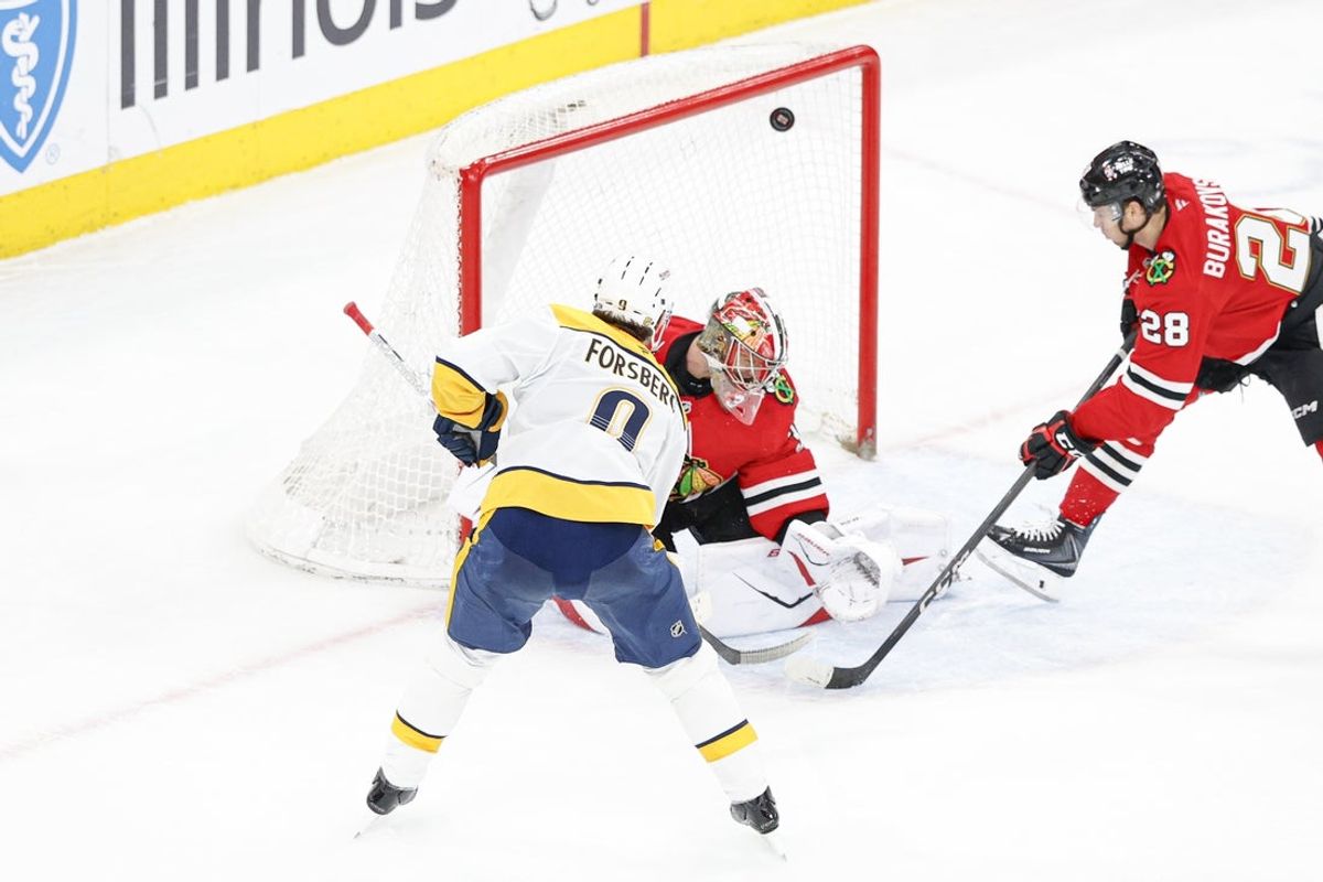 Mar 22, 2026; Chicago, Illinois, USA; Nashville Predators left wing Filip Forsberg (9) scores a game winning goal against the Chicago Blackhawks in overtime at United Center. Mandatory Credit: Kamil Krzaczynski-Imagn Images