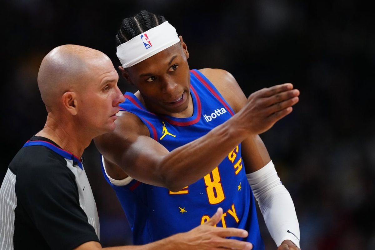 Mar 22, 2026; Denver, Colorado, USA; Denver Nuggets guard Peyton Watson (8) talks to referee Jacyn Goble (68) in the second half against the Portland Trail Blazers at Ball Arena. Mandatory Credit: Ron Chenoy-Imagn Images