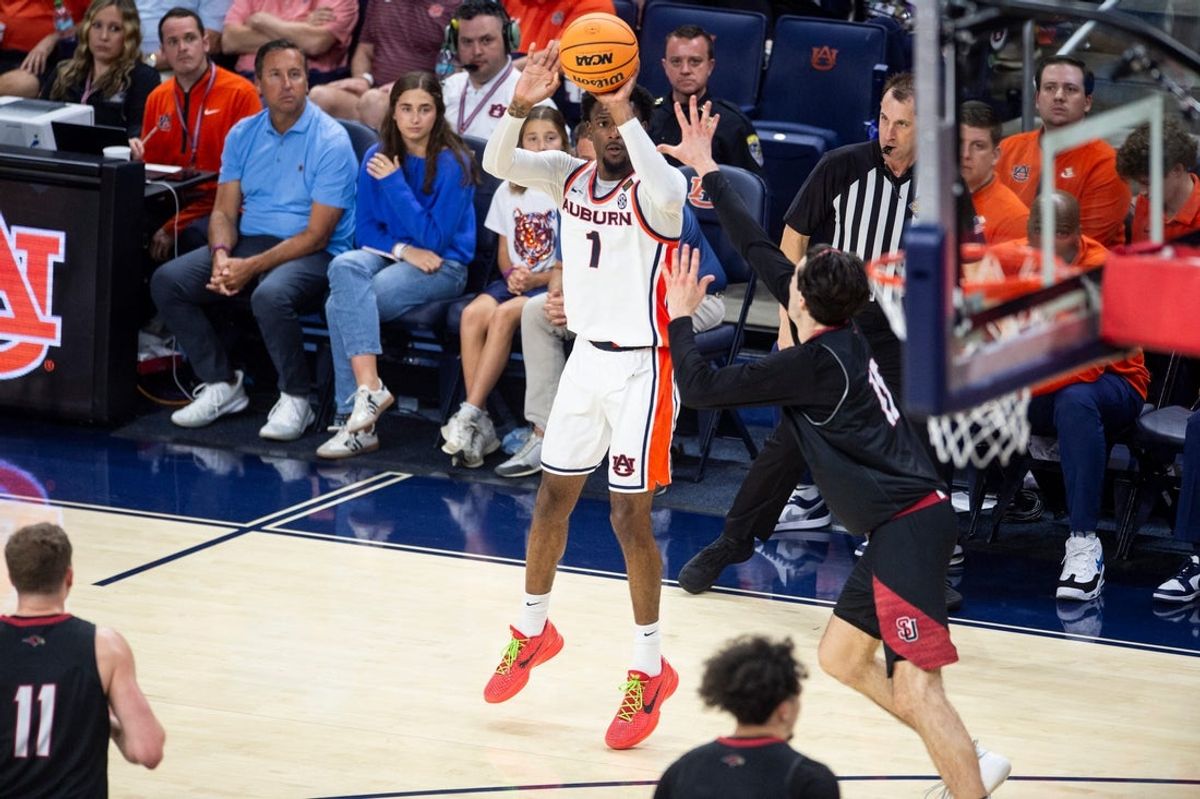 Auburn Tigers guard Kevin Overton (1) takes a jump shot as Auburn Tigers take on Seattle Redhawks during the second round of the National Invitation Tournament at Neville Arena in Auburn, Ala. on Sunday, March 22, 2026. Auburn Tigers defeated Seattle Redhawks 91-85.