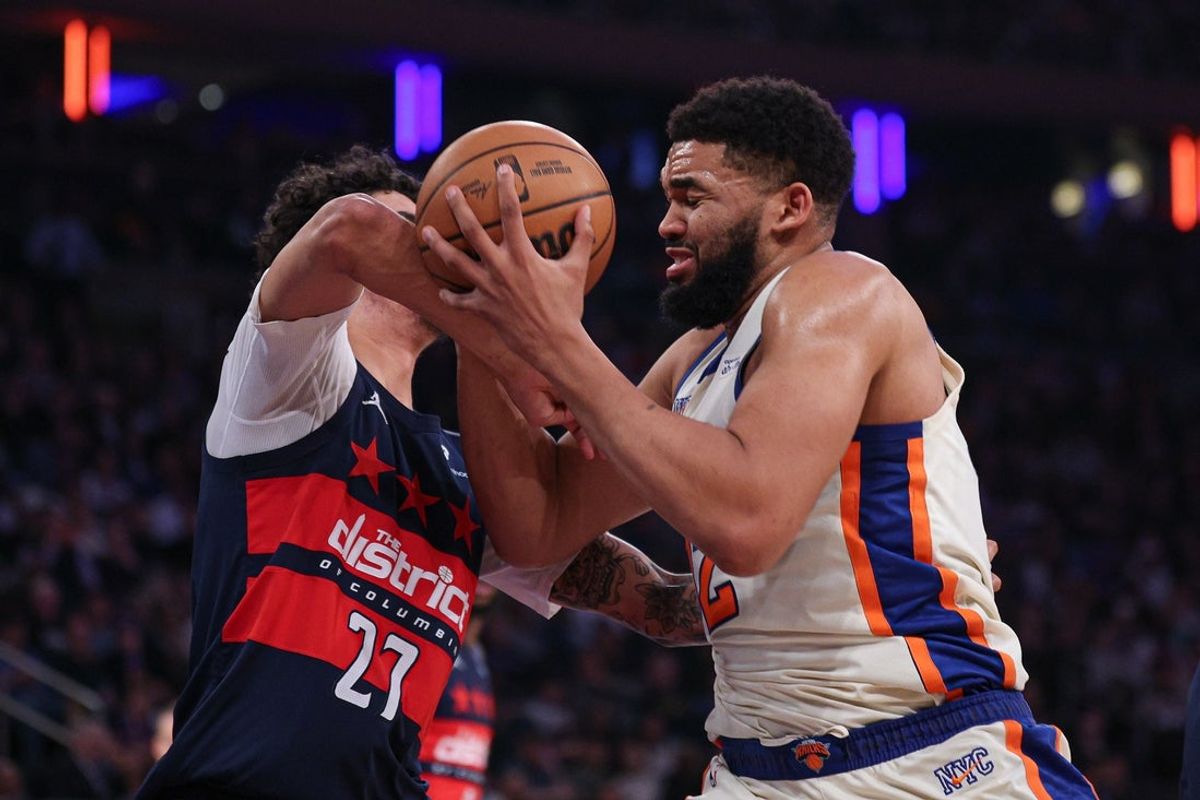 Mar 22, 2026; New York, New York, USA; New York Knicks center Karl-Anthony Towns (32) drives to the basket against Washington Wizards guard Will Riley (27) during the first half at Madison Square Garden. Mandatory Credit: Vincent Carchietta-Imagn Images