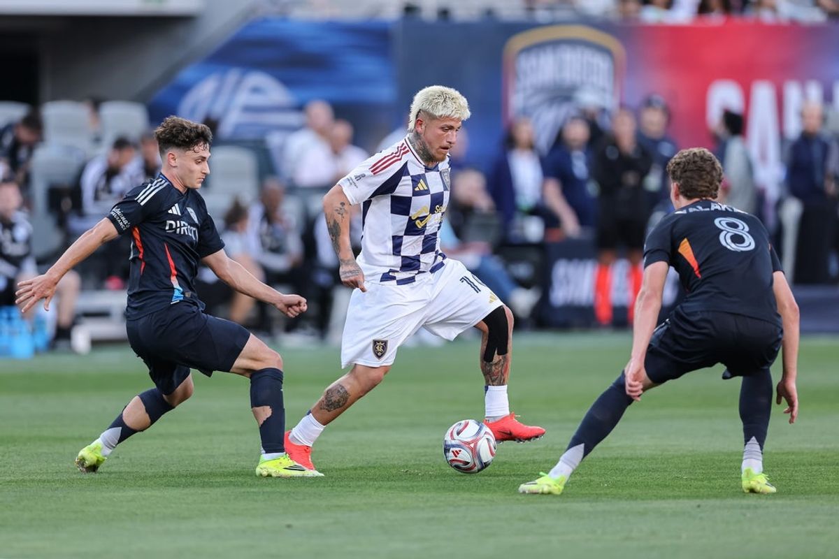 Mar 22, 2026; San Diego, California, USA; Real Salt Lake midfielder Diego Luna (10) moves between San Diego FC defender Luca Bombino (27) and midfielder Onni Valakari (8) during the second half at Snapdragon Stadium. Mandatory Credit: Chadd Cady-Imagn Images