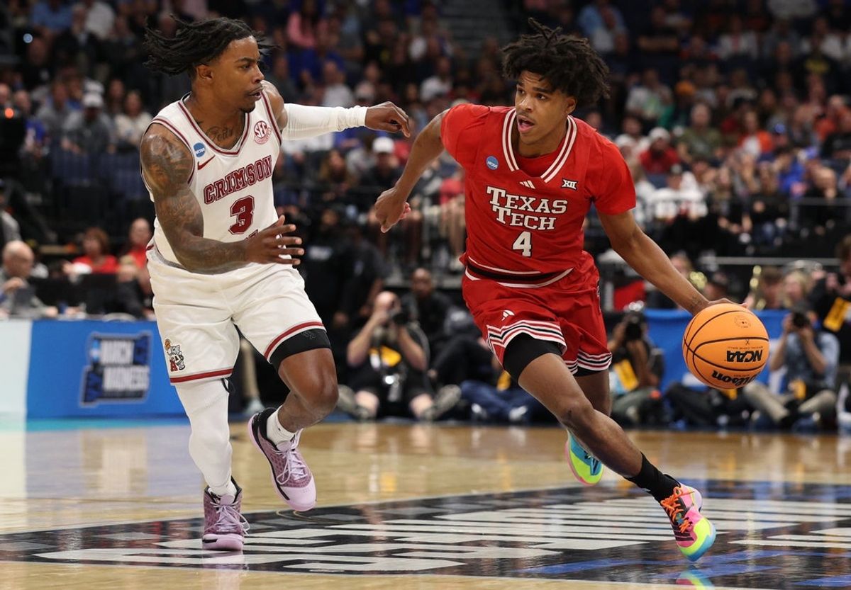 Mar 22, 2026; Tampa, FL, USA; Texas Tech Red Raiders guard Christian Anderson (4) dribbles the ball against Alabama Crimson Tide guard Latrell Wrightsell Jr. (3) in the first half during a second round game of the men's 2026 NCAA Tournament at Benchmark International Arena. Mandatory Credit: Nathan Ray Seebeck-Imagn Images