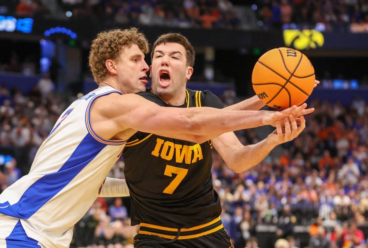 Florida center Micah Handlogten (3) blocks Iowa forward Alvaro Folgueiras (7) during the first half of the NCAA March Madness second round at Benchmark international Arena in Tampa, FL on Friday, March 20, 2026. [Alan Youngblood/Gainesville Sun]