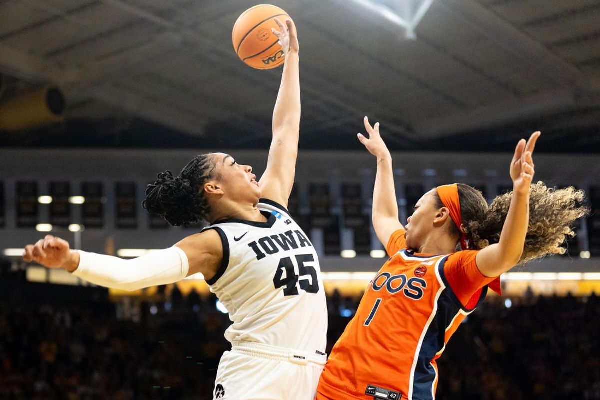 Iowa forward Hannah Stuelke (45) defends a pass made by Virginia guard Paris Clark (1) March 23, 2026 during a Round of 32 NCAA March Madness game at Carver-Hawkeye Arena in Iowa City, Iowa.