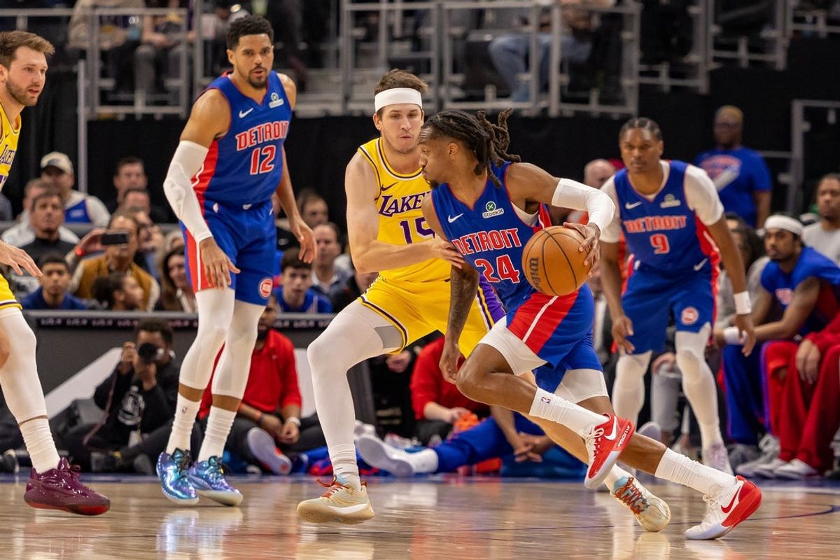 Mar 23, 2026; Detroit, Michigan, USA; Los Angeles Lakers Austin Reaves (15) defends against Detroit Pistons Daniss Jenkins (24) during the first quarter at Little Caesars Arena. Mandatory Credit: David Reginek-Imagn Images
