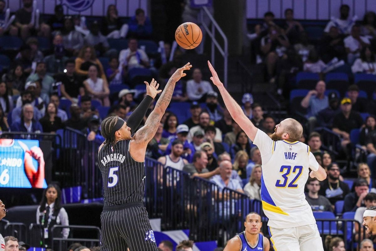 Mar 23, 2026; Orlando, Florida, USA; Orlando Magic forward Paolo Banchero (5) shoots against Indiana Pacers center Jay Huff (32) during the second half at Kia Center. Mandatory Credit: Mike Watters-Imagn Images