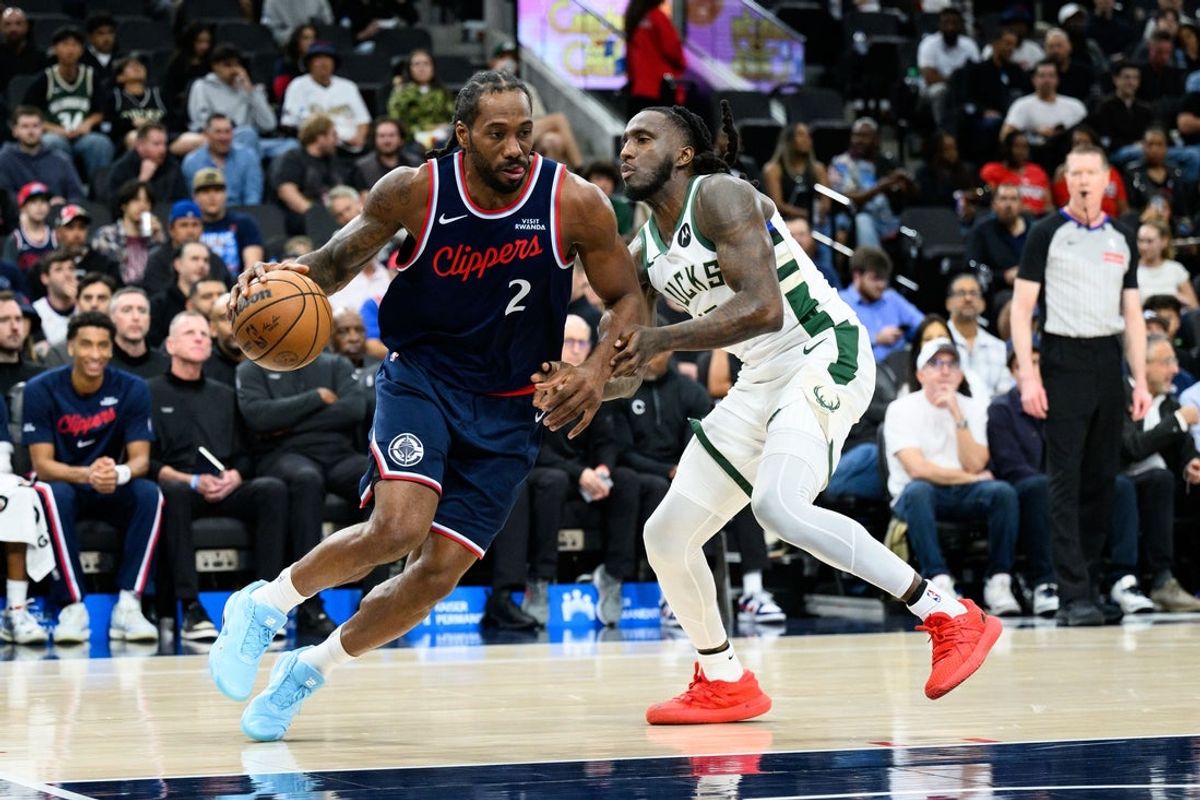 Mar 23, 2026; Inglewood, California, USA; Los Angeles Clippers forward Kawhi Leonard (2) drives the ball while under pressure from Milwaukee Bucks forward Taurean Prince (12) during the first half at Intuit Dome. Mandatory Credit: William Liang-Imagn Images