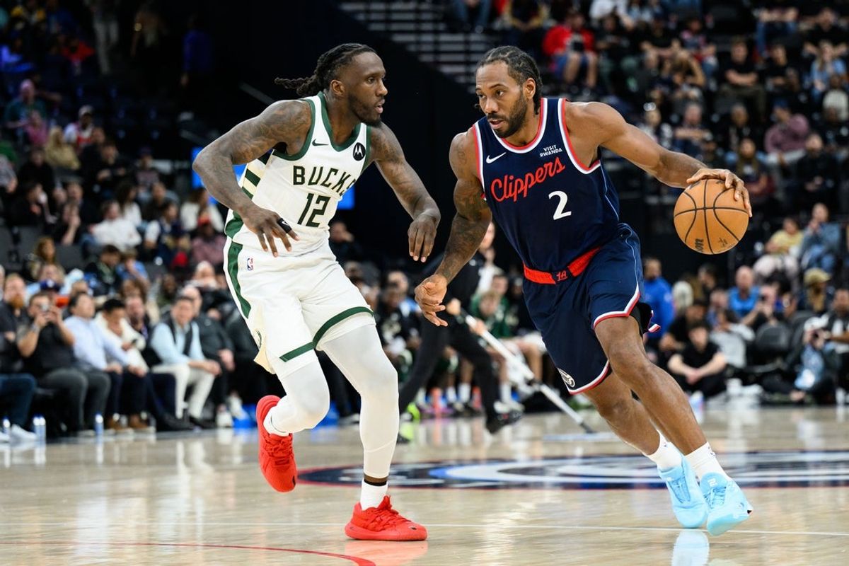Mar 23, 2026; Inglewood, California, USA; Los Angeles Clippers forward Kawhi Leonard (2) drives the ball while under pressure from Milwaukee Bucks forward Taurean Prince (12) during the first half at Intuit Dome. Mandatory Credit: William Liang-Imagn Images