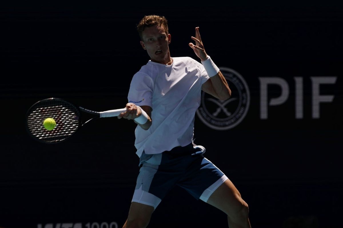 Mar 24, 2026; Miami Gardens, FL, USA; Jiri Lehecka (CZE) hits a forehand against Taylor Fritz (USA) (not pictured) on day eight of the 2026 Miami Open at Hard Rock Stadium. Mandatory Credit: Geoff Burke-Imagn Images