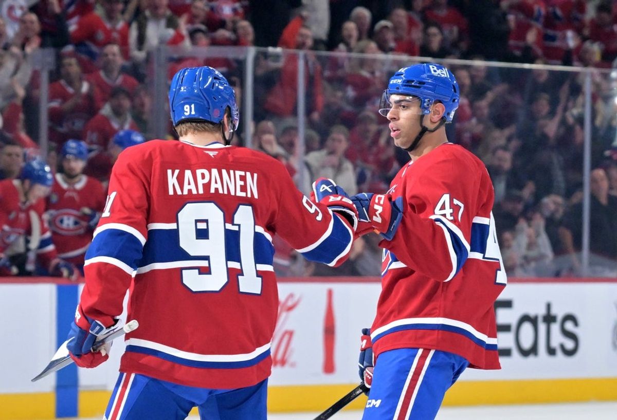 Mar 24, 2026; Montreal, Quebec, CAN; Montreal Canadiens forward Oliver Kapanen (91) celebrates with teammate defenseman Jayden Struble (47) after scoring a goal against the Carolina Hurricanes during the first period at the Bell Centre. Mandatory Credit: Eric Bolte-Imagn Images