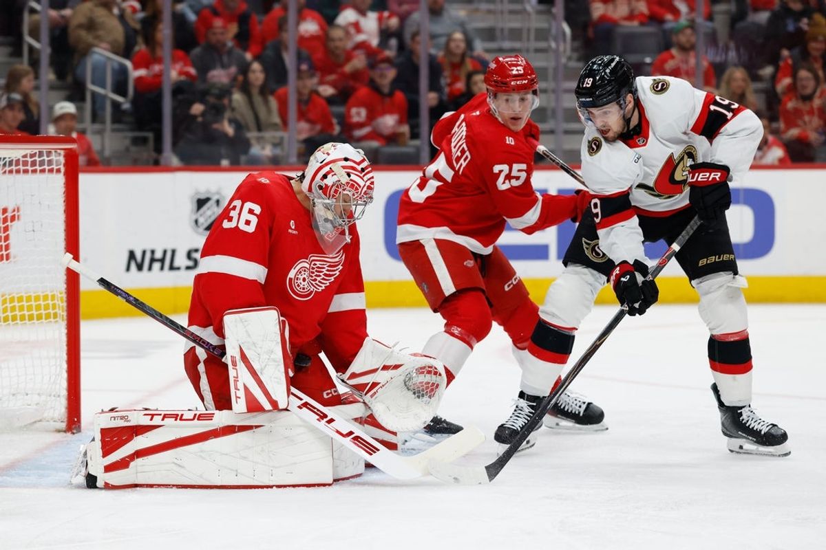 Mar 24, 2026; Detroit, Michigan, USA;  Detroit Red Wings goaltender John Gibson (36) makes a save on Ottawa Senators right wing Drake Batherson (19) in the first period at Little Caesars Arena. Mandatory Credit: Rick Osentoski-Imagn Images