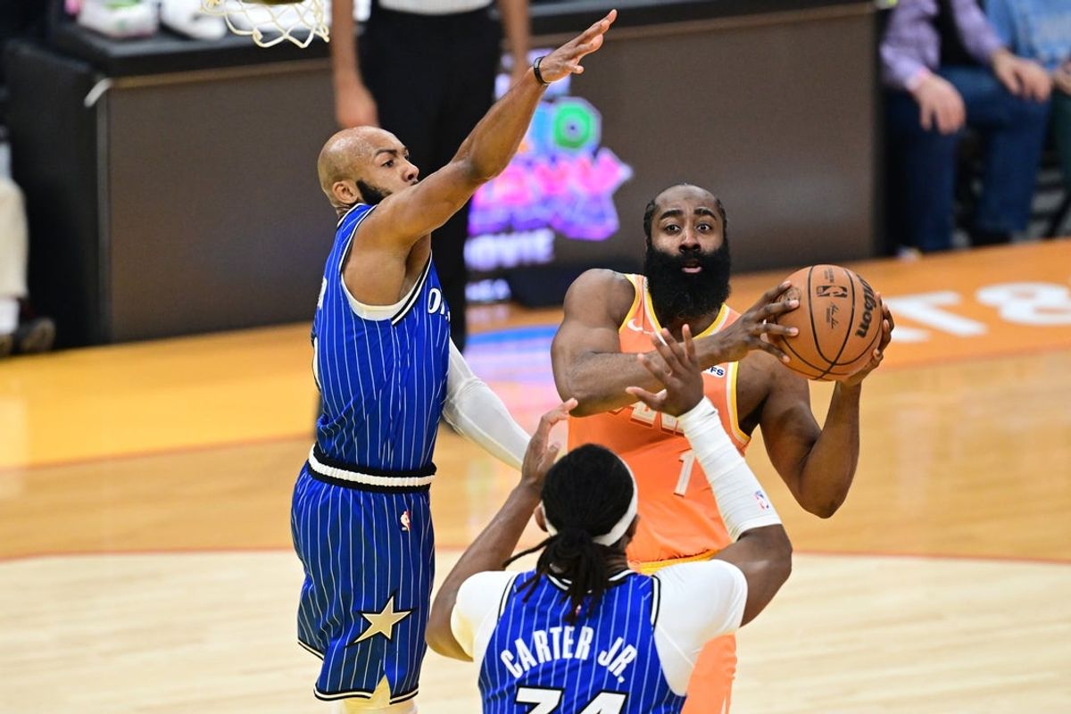 Mar 24, 2026; Cleveland, Ohio, USA; Cleveland Cavaliers guard James Harden (1) goes to the basket against Orlando Magic guard Jevon Carter (2) and center Wendell Carter Jr. (34) during the first half at Rocket Arena. Mandatory Credit: David Dermer-Imagn Images