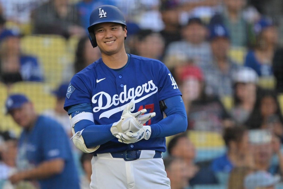 Mar 24, 2026; Los Angeles, California, USA;  Los Angeles Dodgers two-way player Shohei Ohtani (17) on deck in the fourth against the Los Angeles Angels at Dodger Stadium. Mandatory Credit: Jayne Kamin-Oncea-Imagn Images