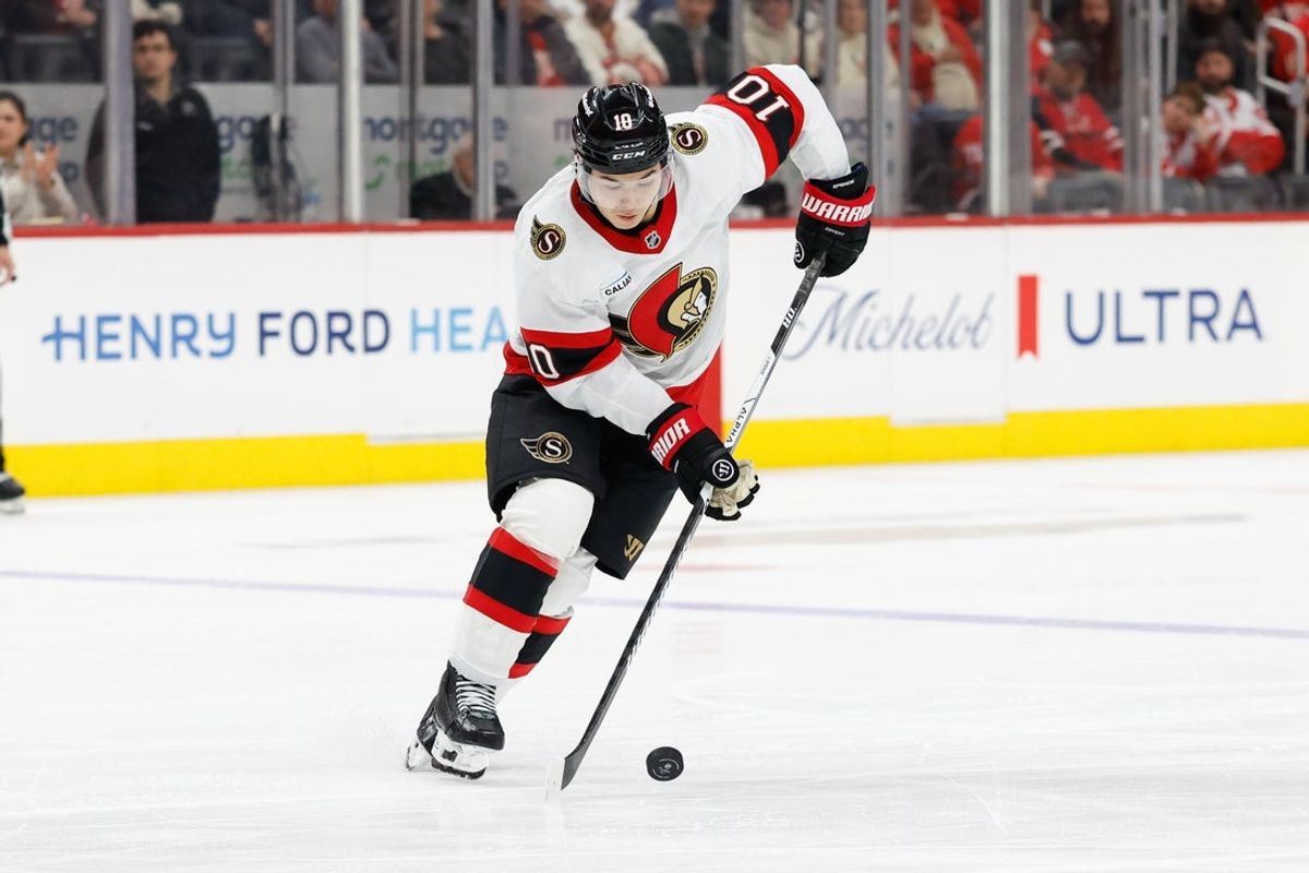 Mar 24, 2026; Detroit, Michigan, USA;  Ottawa Senators defenseman Jordan Spence (10) skates with the puck in the third period against the Detroit Red Wings at Little Caesars Arena. Mandatory Credit: Rick Osentoski-Imagn Images