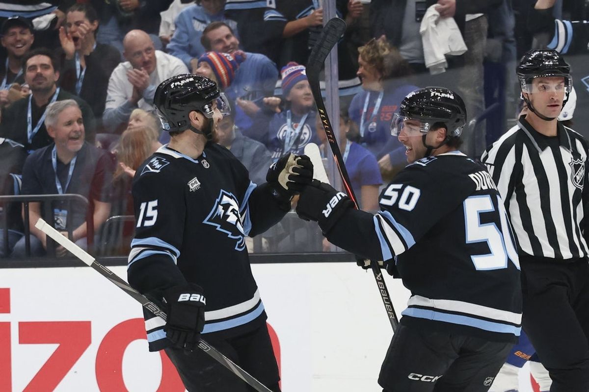 Mar 24, 2026; Salt Lake City, Utah, USA; Utah Mammoth center Alexander Kerfoot (15) celebrates scoring a goal against the Edmonton Oilers with defenseman Sean Durzi (50) during the first period at Delta Center. Mandatory Credit: Rob Gray-Imagn Images