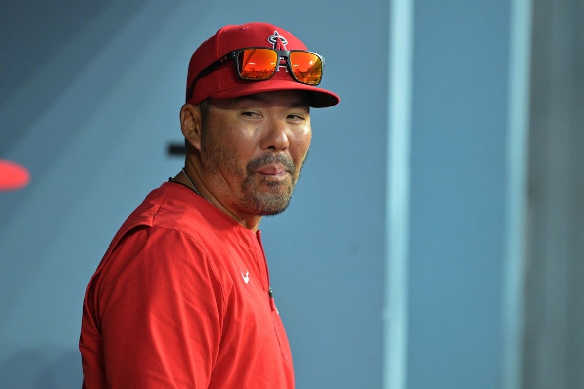 Mar 24, 2026; Los Angeles, California, USA;  Los Angeles Angels manager Kurt Suzuki (8) in the dugout during the game against the Los Angeles Dodgers at Dodger Stadium. Mandatory Credit: Jayne Kamin-Oncea-Imagn Images