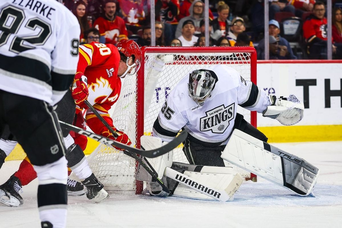 Mar 24, 2026; Calgary, Alberta, CAN; Los Angeles Kings goaltender Darcy Kuemper (35) makes a save against Calgary Flames left wing Blake Coleman (20) during the second period at Scotiabank Saddledome. Mandatory Credit: Sergei Belski-Imagn Images