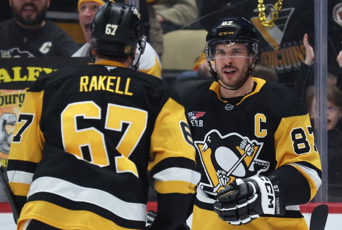 Mar 24, 2026; Pittsburgh, Pennsylvania, USA;  Pittsburgh Penguins center Sidney Crosby (87) congratulates right wing Rickard Rakell (67) on his goal against the Colorado Avalancheduring the third period at PPG Paints Arena. Mandatory Credit: Charles LeClaire-Imagn Images