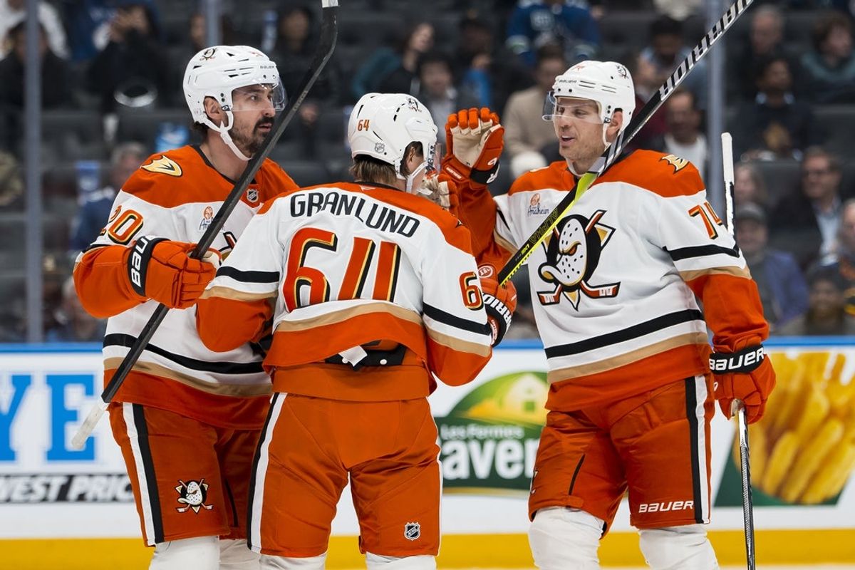 Mar 24, 2026; Vancouver, British Columbia, CAN; Anaheim Ducks forward Chris Kreider (20) and forward Mikael Granlund (64) and defenseman John Carlson (74) celebrate Granlund’s goal against the Vancouver Canucks in the third period at Rogers Arena. Mandatory Credit: Bob Frid-Imagn Images