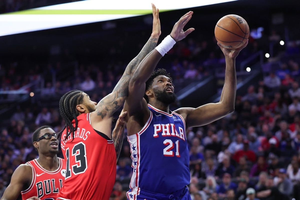 Mar 25, 2026; Philadelphia, Pennsylvania, USA; Philadelphia 76ers center Joel Embiid (21) drives for a shot against Chicago Bulls center Nick Richards (13) during the first quarter at Xfinity Mobile Arena. Mandatory Credit: Bill Streicher-Imagn Images