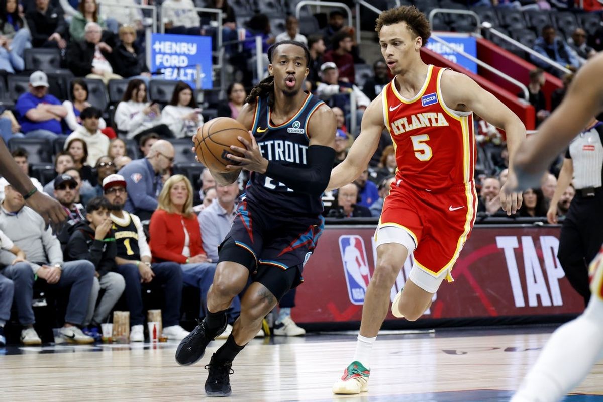 Mar 25, 2026; Detroit, Michigan, USA;  Detroit Pistons guard Daniss Jenkins (24) dribbles defended by Atlanta Hawks guard Dyson Daniels (5) in the first half at Little Caesars Arena. Mandatory Credit: Rick Osentoski-Imagn Images