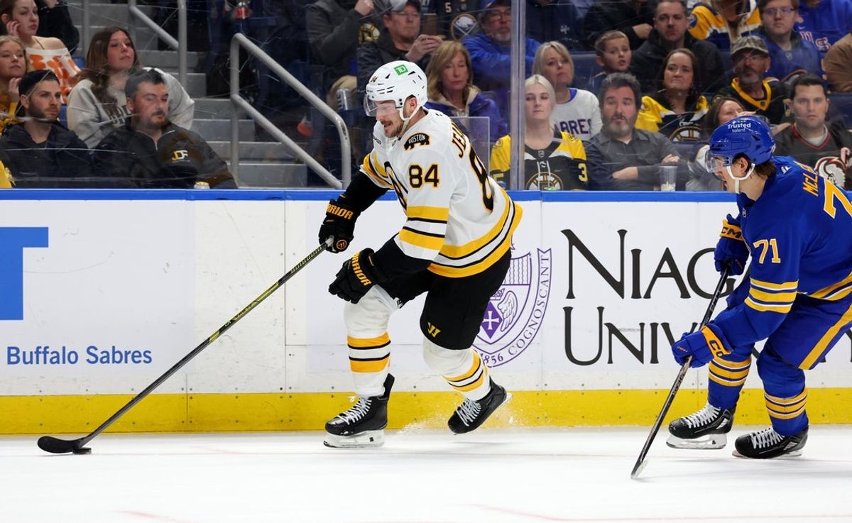 Mar 25, 2026; Buffalo, New York, USA;  Boston Bruins left wing Tanner Jeannot (84) carries the puck up ice during the first period against the Buffalo Sabres at KeyBank Center. Mandatory Credit: Timothy T. Ludwig-Imagn Images