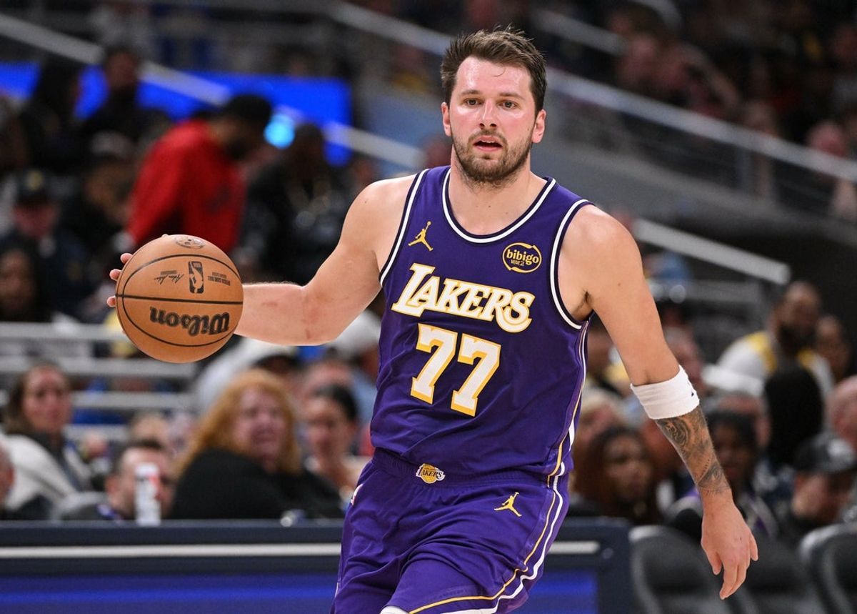 Mar 25, 2026; Indianapolis, Indiana, USA;  Los Angeles Lakers guard Luka Doncic (77) dribbles the ball down court during the second half against the Indiana Pacers at Gainbridge Fieldhouse. Mandatory Credit: Marc Lebryk-Imagn Images