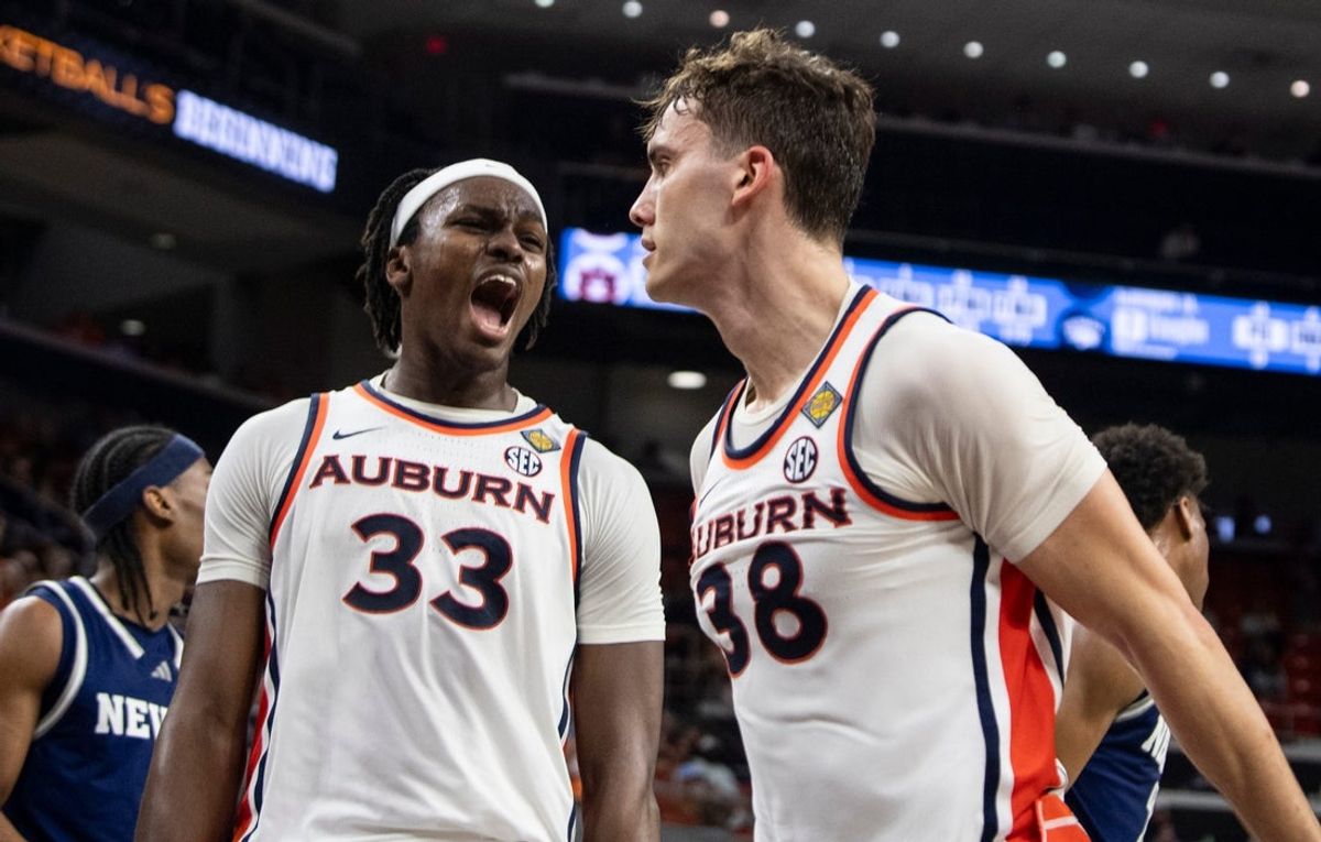 Auburn Tigers forwards Sebastian Williams-Adams (33) and Filip Jovic (38) celebrate Jovic’s dunk as Auburn Tigers take on Nevada Wolfpack during the third round of the National Invitation Tournament at Neville Arena in Auburn, Ala. on Wednesday, March 25, 2026. Auburn Tigers lead Nevada Wolfpack 38-26 at halftime.