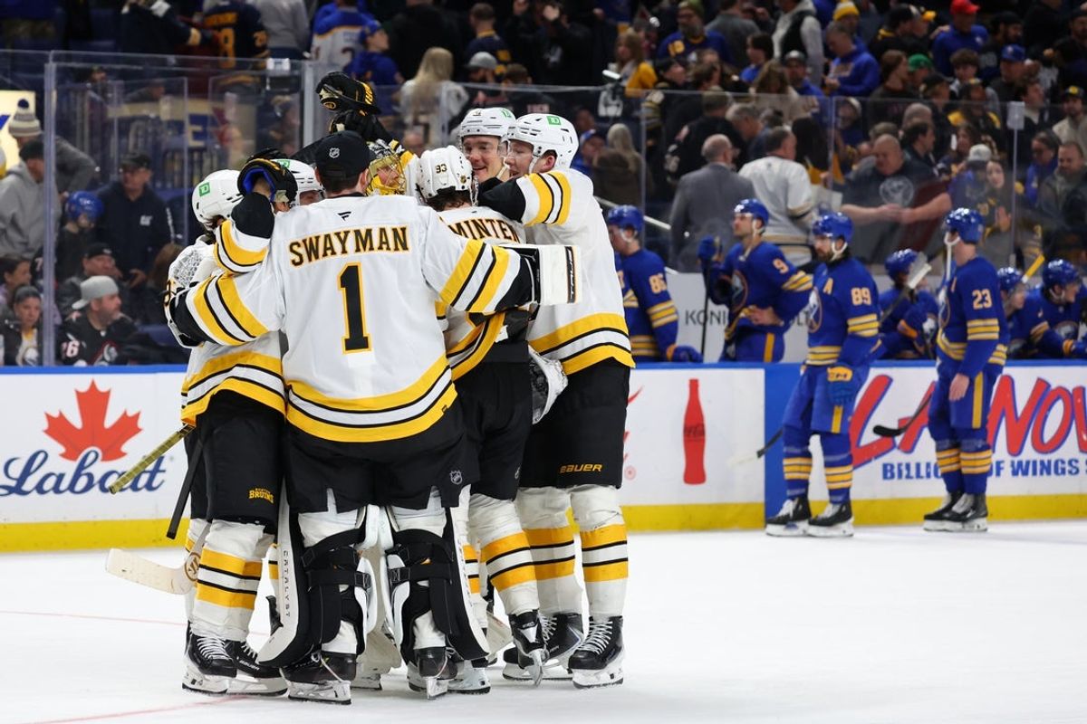 Mar 25, 2026; Buffalo, New York, USA;  The Boston Bruins celebrate a win over the Buffalo Sabres at KeyBank Center. Mandatory Credit: Timothy T. Ludwig-Imagn Images