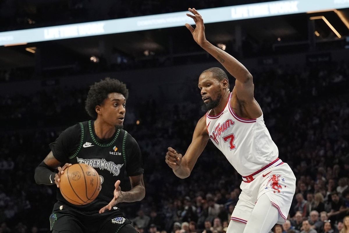 Mar 25, 2026; Minneapolis, Minnesota, USA; Minnesota Timberwolves forward Jaden McDaniels (3) works around Houston Rockets forward Kevin Durant (7) in the first quarter at Target Center. Mandatory Credit: Bruce Kluckhohn-Imagn Images