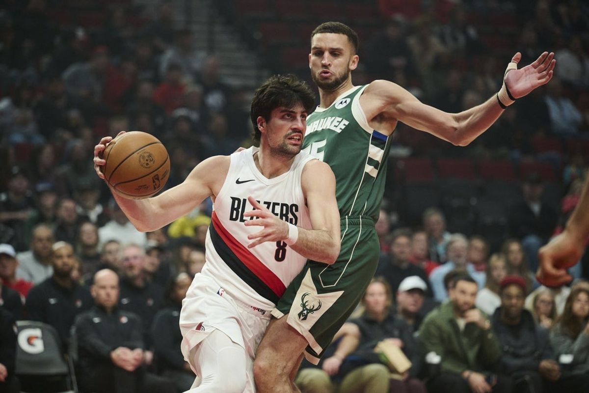 Mar 25, 2026; Portland, Oregon, USA;  Portland Trail Blazers forward Deni Avdija (8) drives to the basket during the first half against Milwaukee Bucks forward Pete Nance (35) at Moda Center. Mandatory Credit: Troy Wayrynen-Imagn Images