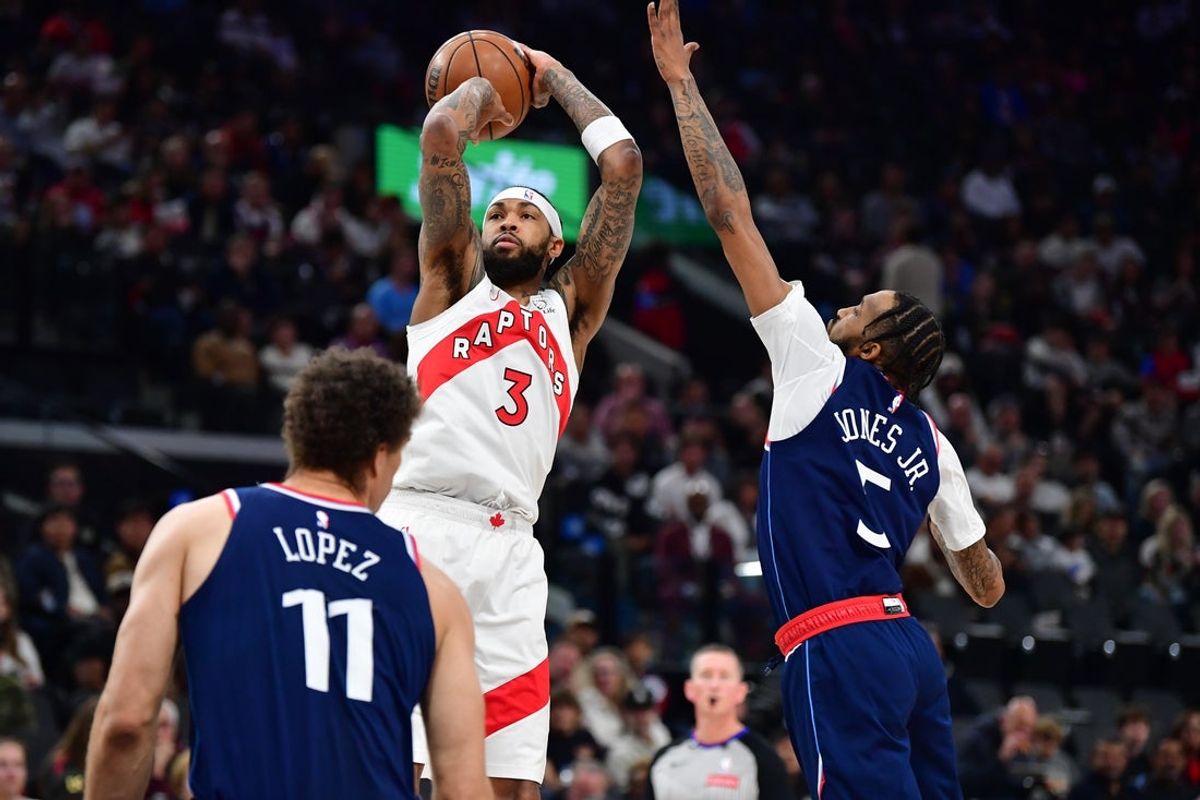 Mar 25, 2026; Inglewood, California, USA;  Toronto Raptors forward Brandon Ingram (3) shoots against Los Angeles Clippers forward Derrick Jones Jr. (5) during the first half at Intuit Dome. Mandatory Credit: Gary A. Vasquez-Imagn Images