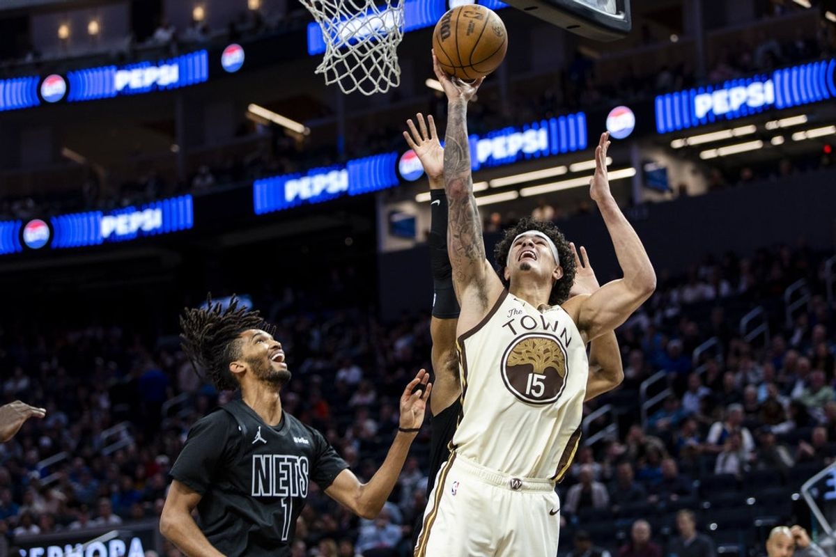 Mar 25, 2026; San Francisco, California, USA; Golden State Warriors forward Gui Santos (15) shoots as Brooklyn Nets forward Ziaire Williams (1) watches during the third quarter at Chase Center. Mandatory Credit: John Hefti-Imagn Images