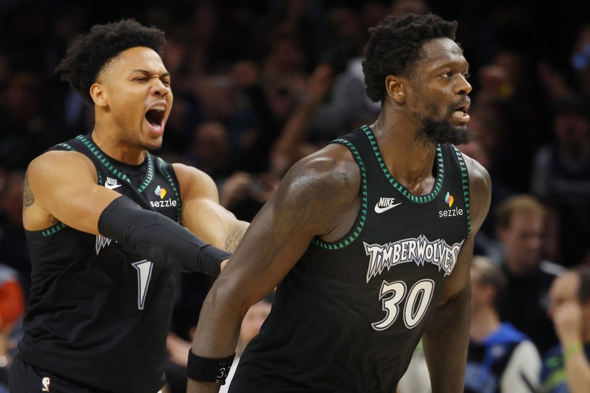 Mar 25, 2026; Minneapolis, Minnesota, USA; Minnesota Timberwolves guard Terrence Shannon Jr. (1) celebrates the basket by forward Julius Randle (30) against the Houston Rockets in overtime at Target Center. Mandatory Credit: Bruce Kluckhohn-Imagn Images