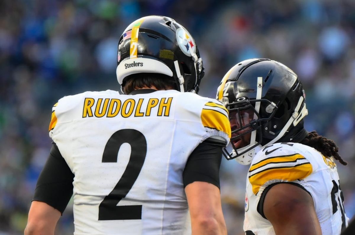 Dec 31, 2023; Seattle, Washington, USA; Pittsburgh Steelers quarterback Mason Rudolph (2) and running back Najee Harris (22) celebrate after Harris scored a touchdown against the Seattle Seahawks during the second half at Lumen Field.
