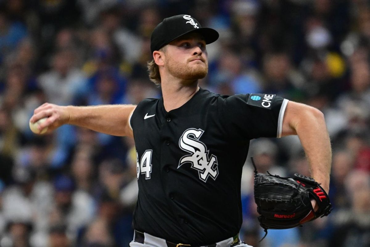 Mar 26, 2026; Milwaukee, Wisconsin, USA; Chicago White Sox starting pitcher Shane Smith (64) shows a pitch in the first inning against the Milwaukee Brewers at American Family Field. Mandatory Credit: Benny Sieu-Imagn Images