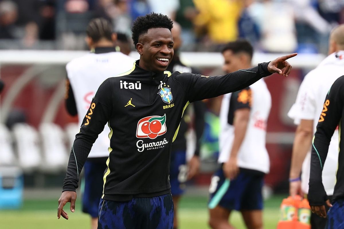 Mar 26, 2026; Foxborough, Massachusetts, USA; Brazil forward Vinicius Junior (10) smiles at a teammate before their game against France at Gillette Stadium. Mandatory Credit: Winslow Townson-Imagn Images