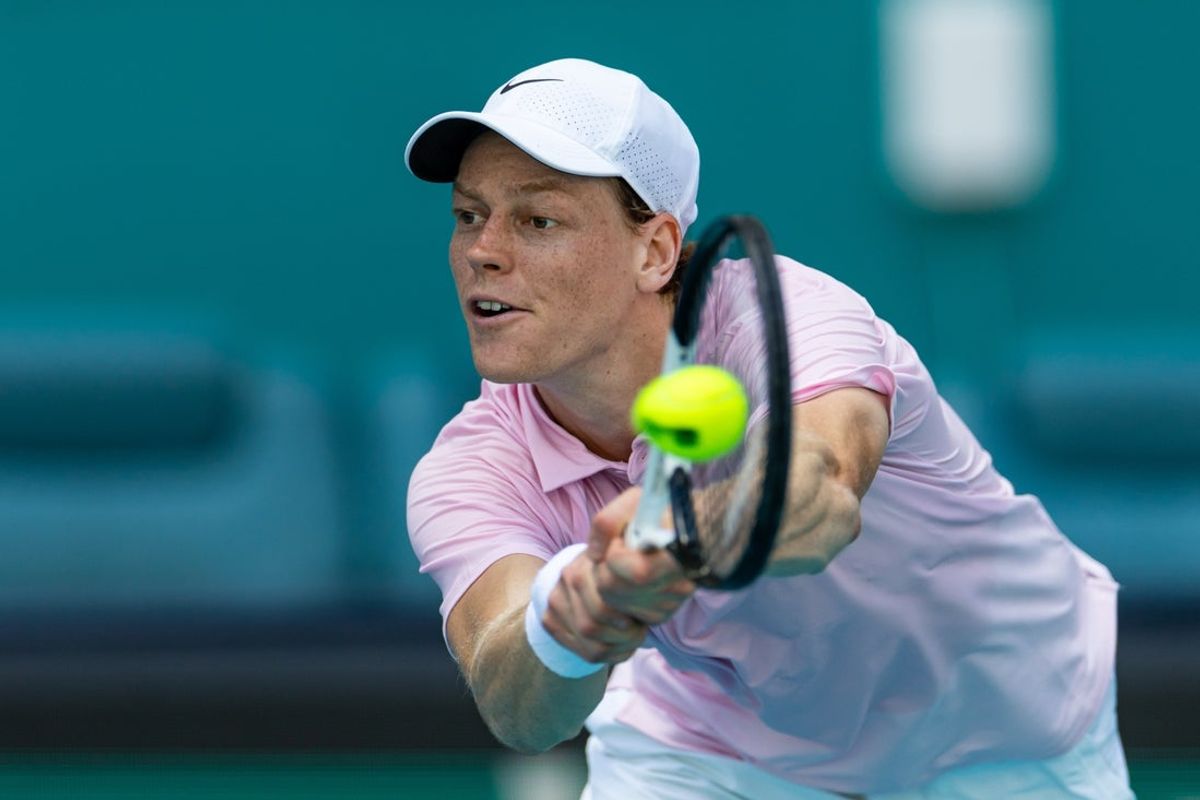 Mar 26, 2026; Miami Gardens, FL, USA; Jannik Sinner of Italy returns a point during a match against Frances Tiafoe of the United States in the quarter finals of the men’s singles at the Miami Open at Hard Rock Stadium. Mandatory Credit: Mike Frey-Imagn Images