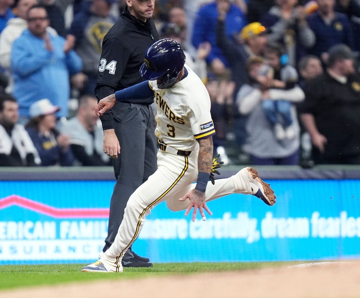 Milwaukee Brewers shortstop Joey Ortiz (3) runs past third as Milwaukee Brewers catcher William Contreras (24) doubles (1) on a ground ball to Chicago White Sox left fielder Austin Hays (21) during the second inning of the Opening Day game on Thursday March 26, 2026 at American Family Field in Milwaukee, Wisconsin.