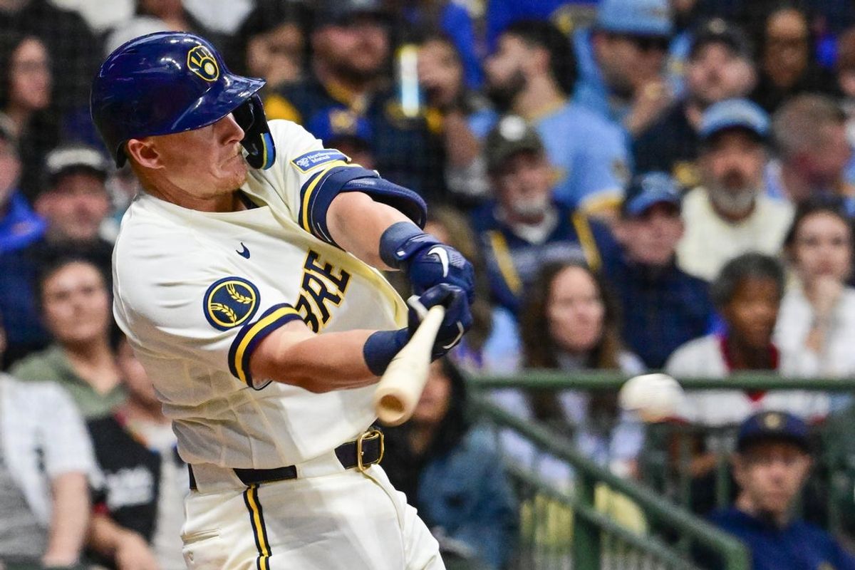 Mar 26, 2026; Milwaukee, Wisconsin, USA;  Milwaukee Brewers first baseman Andrew Vaughn (28) drives in a run with a base hit in the sixth inning against the Chicago White Sox at American Family Field. Mandatory Credit: Benny Sieu-Imagn Images