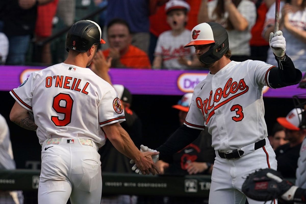Mar 26, 2026; Baltimore, Maryland, USA; Baltimore Orioles outfielder Tyler O’Neil (9) greeted by second baseman Blaze Alexander (3) after scoring a run during the eighth inning against the Minnesota Twins at Oriole Park at Camden Yards. Mandatory Credit: Mitch Stringer-Imagn Images
