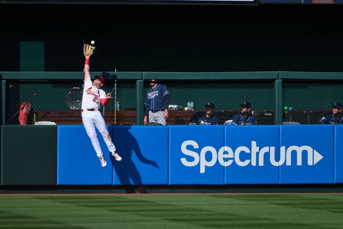 Mar 26, 2026; St. Louis, Missouri, USA; St. Louis Cardinals left fielder Nathan Church (27) leaps at the wall and robs a home run from Tampa Bay Rays left fielder Ryan Vilade (not pictured) during the fifth inning at Busch Stadium. Mandatory Credit: Jeff Curry-Imagn Images