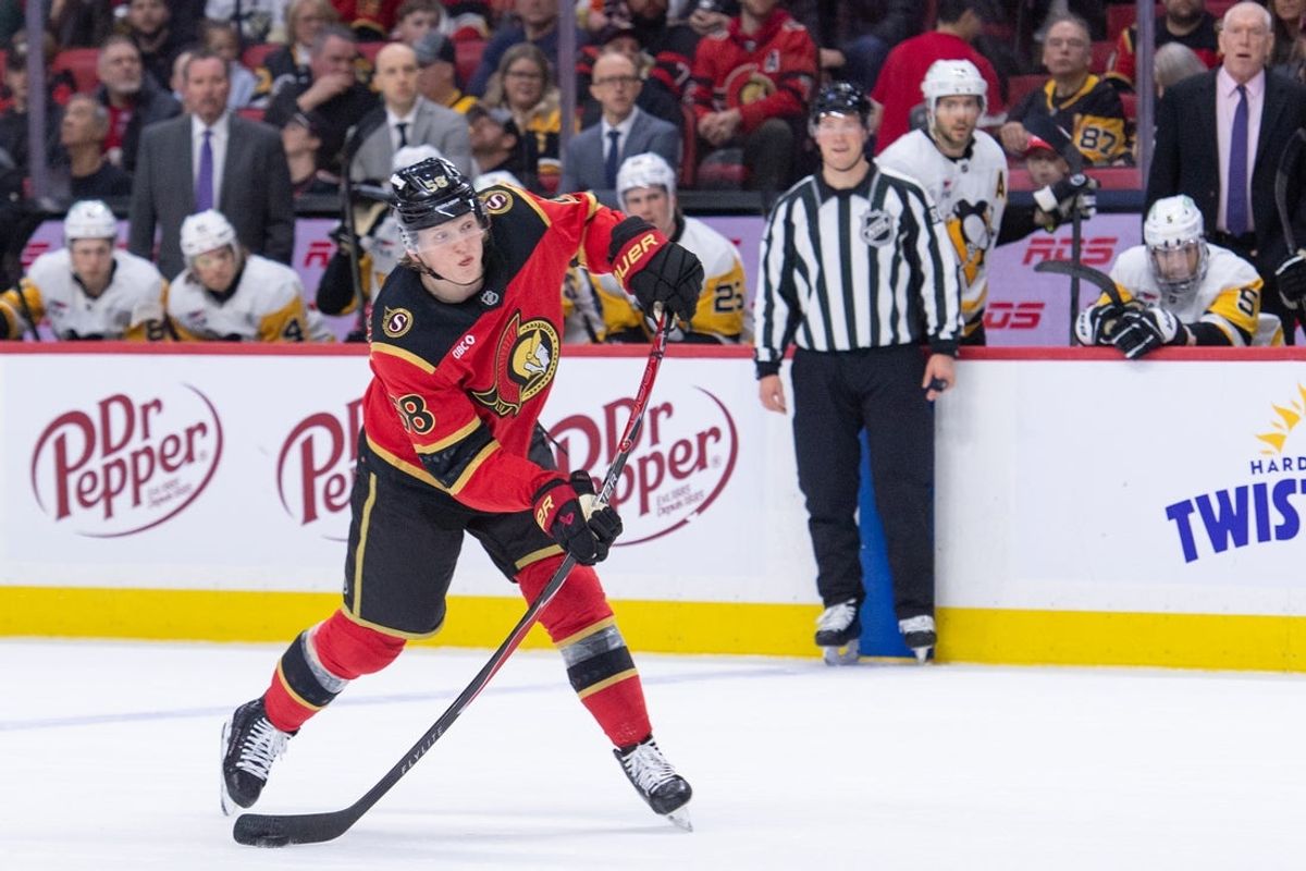 Mar 26, 2026; Ottawa, Ontario, CAN; Ottawa Senators defenseman Carter Yakemchuk (58) shoots the puck in the first period against the Pittsburgh Penguins at the Canadian Tire Centre. Mandatory Credit: Marc DesRosiers-IMAGN Images