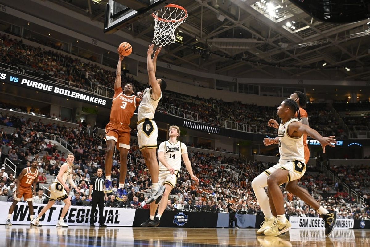 Mar 26, 2026; San Jose, CA, USA; Texas Longhorns forward Dailyn Swain (3) shoots past Purdue Boilermakers forward Trey Kaufman-Renn (4) in the first half during a Sweet Sixteen game of the West Regional of the men's 2026 NCAA Tournament at SAP Center. Mandatory Credit: Eakin Howard-Imagn Images