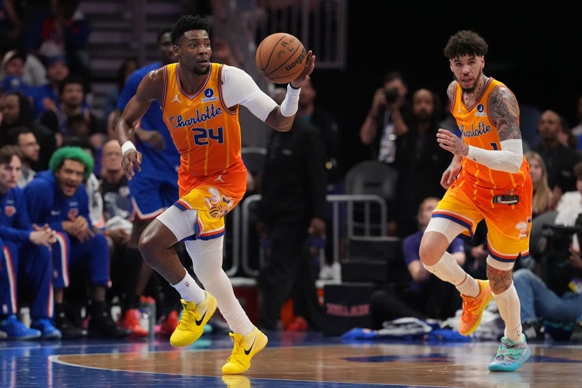 Mar 26, 2026; Charlotte, North Carolina, USA;  Charlotte Hornets forward Brandon Miller (24) grabs the rebound and brings the ball up court against the New York Knicks during the second quarter at the Spectrum Center. Mandatory Credit: Jim Dedmon-Imagn Images