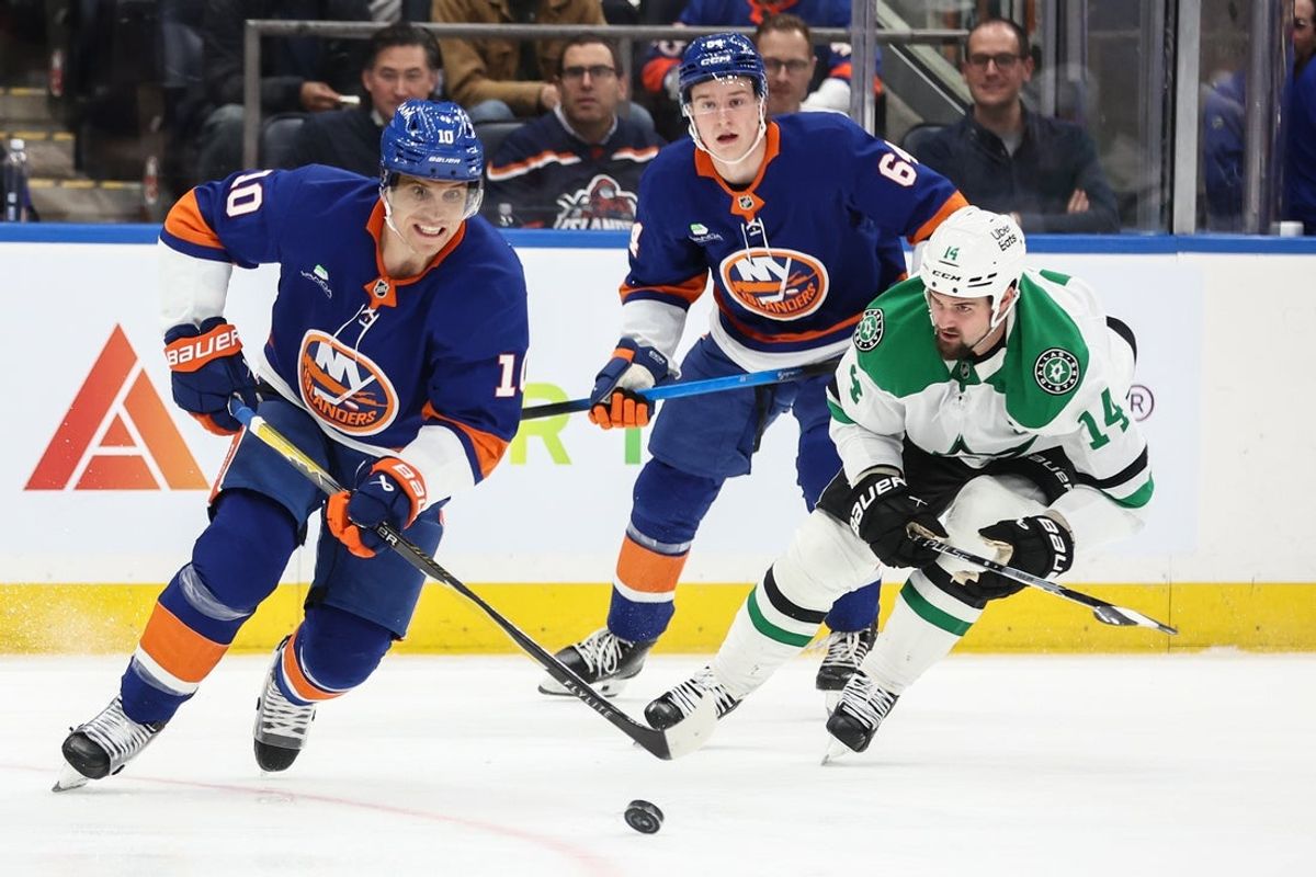 Mar 26, 2026; Elmont, New York, USA;  New York Islanders center Brayden Schenn (10) and Dallas Stars left wing Jamie Benn (14) chase the puck in the second period at UBS Arena. Mandatory Credit: Wendell Cruz-Imagn Images