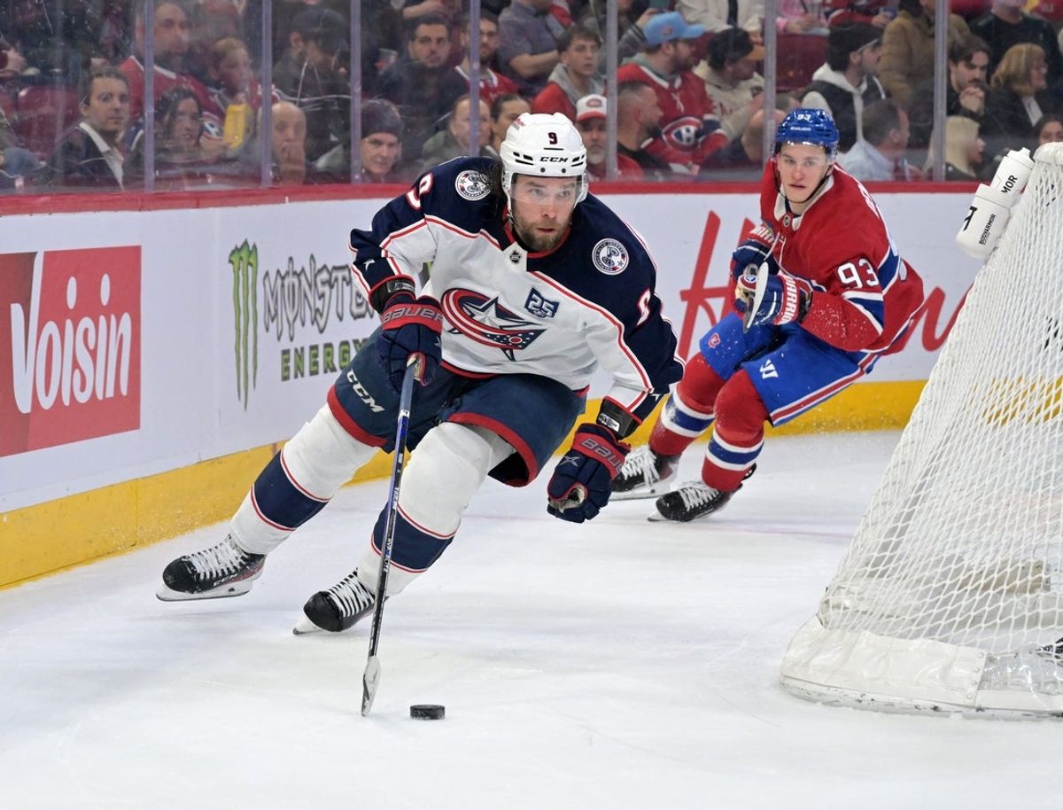 Mar 26, 2026; Montreal, Quebec, CAN; Columbus Blue Jackets defenseman Ivan Provorov (9) plays the puck and Montreal Canadiens forward Ivan Demidov (93) forechecks during the second period at the Bell Centre. Mandatory Credit: Eric Bolte-Imagn Images