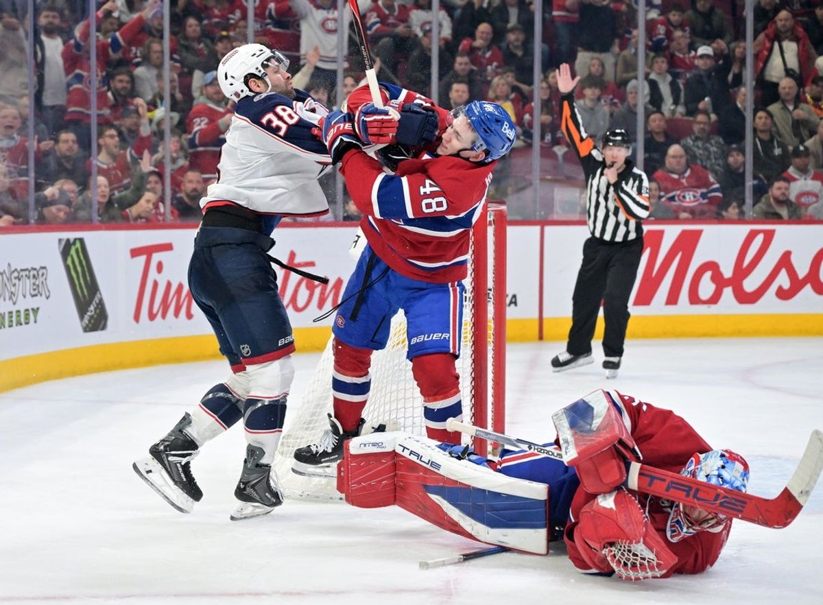 Mar 26, 2026; Montreal, Quebec, CAN; Montreal Canadiens defenseman Lane Hutson (48) squares off with Columbus Blue Jackets forward Boone Jenner (38) after Jenner collided with Montreal Canadiens goalie Jakub Dobes (75) during the third period at the Bell Centre. Mandatory Credit: Eric Bolte-Imagn Images