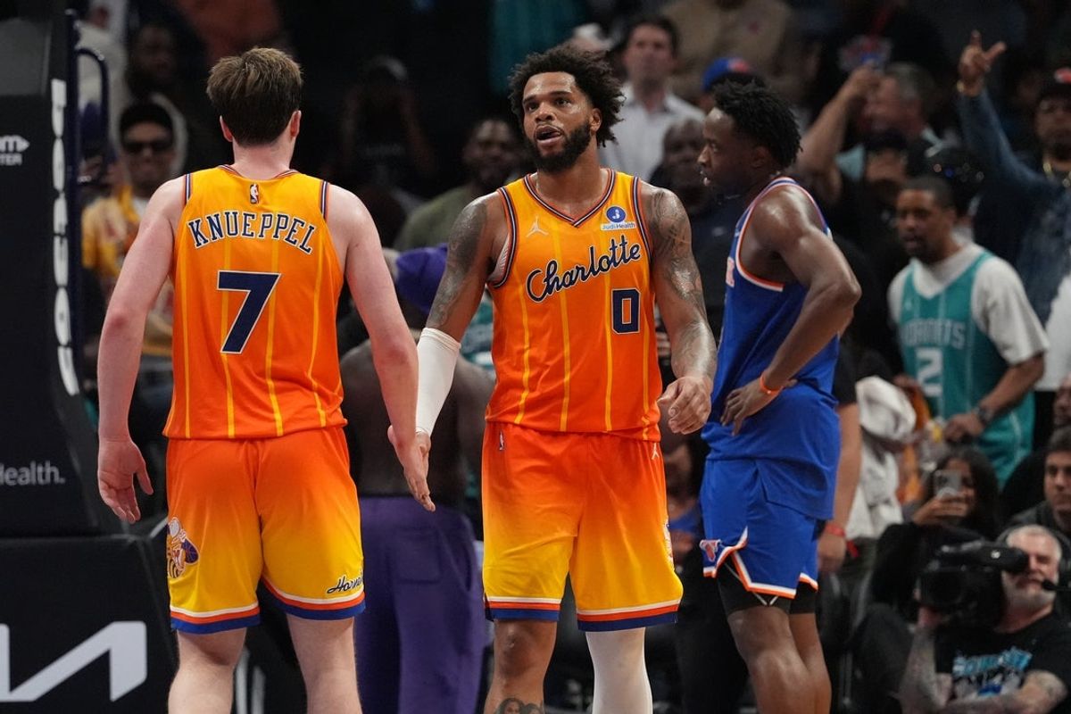 Mar 26, 2026; Charlotte, North Carolina, USA;  Charlotte Hornets forward Miles Bridges (0) and guard/forward Kon Knueppel (7) celebrate the win over New York Knicks during the second half at the Spectrum Center. Mandatory Credit: Jim Dedmon-Imagn Images